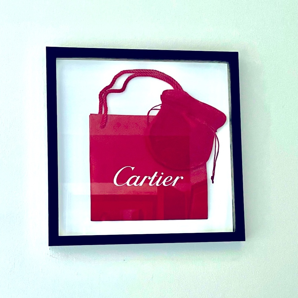 Framed Cartier shopping bag with pouch.